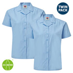 Two light blue short-sleeve button-up school uniforms with pointed collars, shown as a twin pack on a white background with 'TWIN PACK' and 'ECO-UNIFORM' badges.